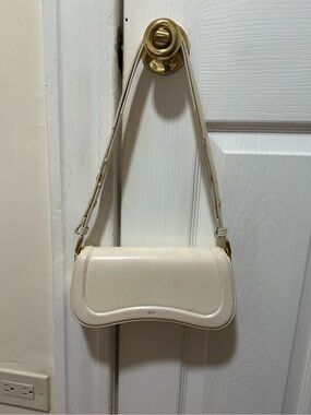 JW PEI White Shoulder Bag - Elegant Curved Flap Design